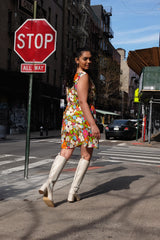 A silk mini dress with a plunged neckline in a vintage floral print